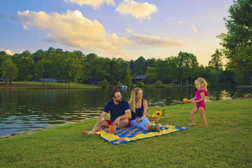 Family having a picnic beside Lake Oconee.