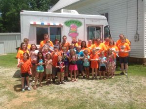 Children enjoying ice cream from Scoops Emporium truck | Best Small Town Restaurants in Georgia | Madison GA Restaurants | Visit Madison GA