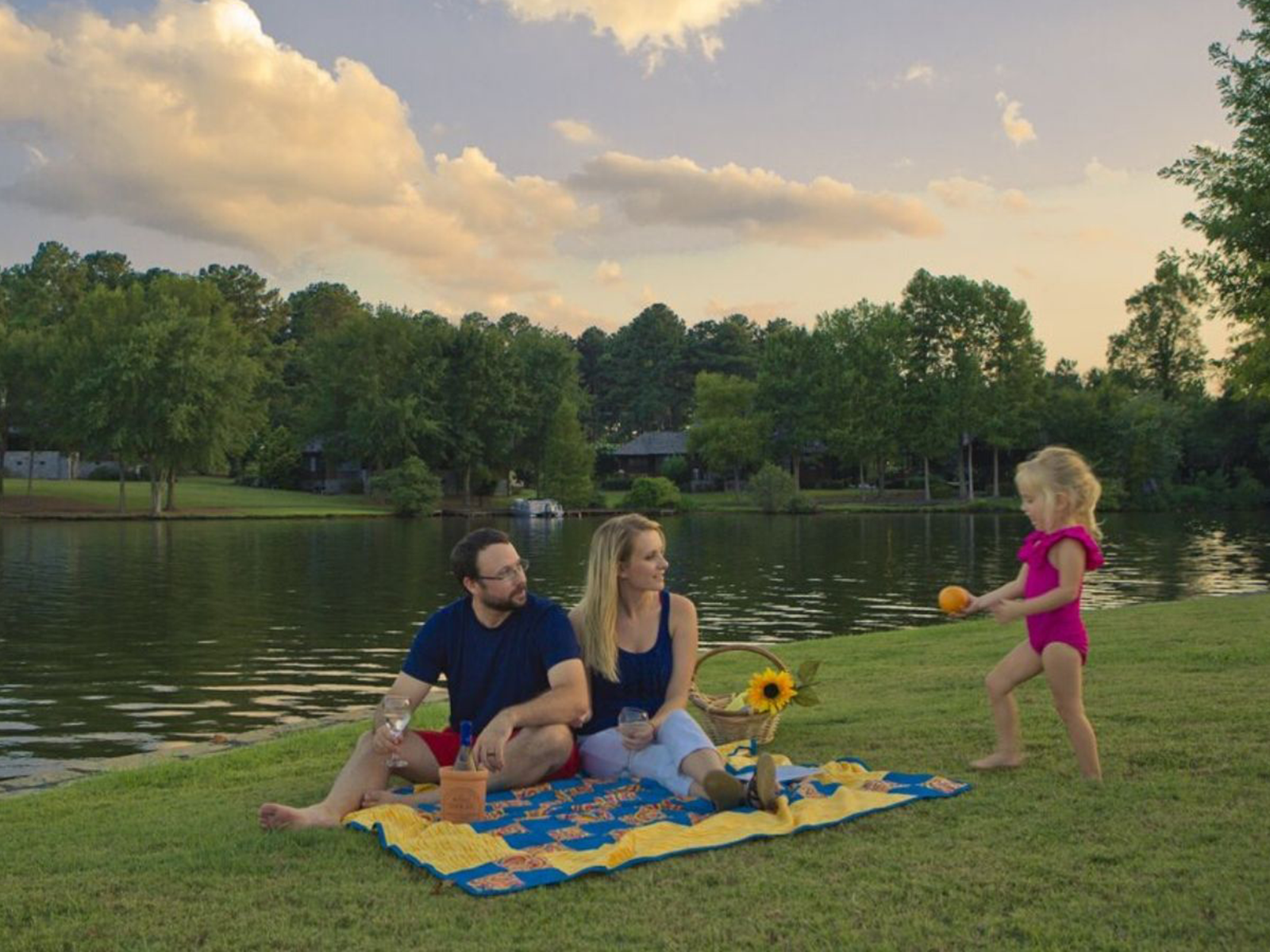 Family enjoys a picnic at sunset at Lake Oconee | Georgia Attractions | Things to Do in Madison Georgia | Visit Madison GA