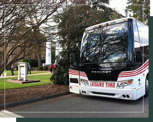 A motorcoach transports a group tour to Heritage Hall | Group Travel | Group Trip Planning Madison GA | Visit Madison GA