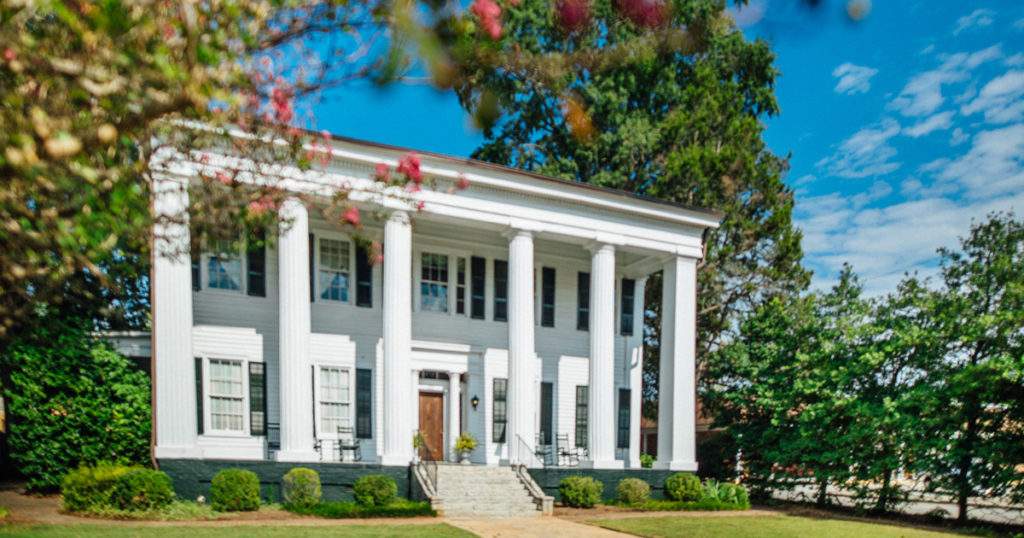 Heritage Hall - Greek Revival historic house museum in spring