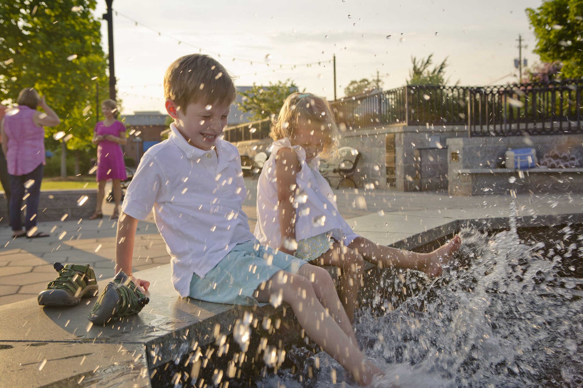 Children playing in the Cook Fountain in Madison Town Park | Best Small Towns In Georgia | Visit Georgia | Visit Madison GA