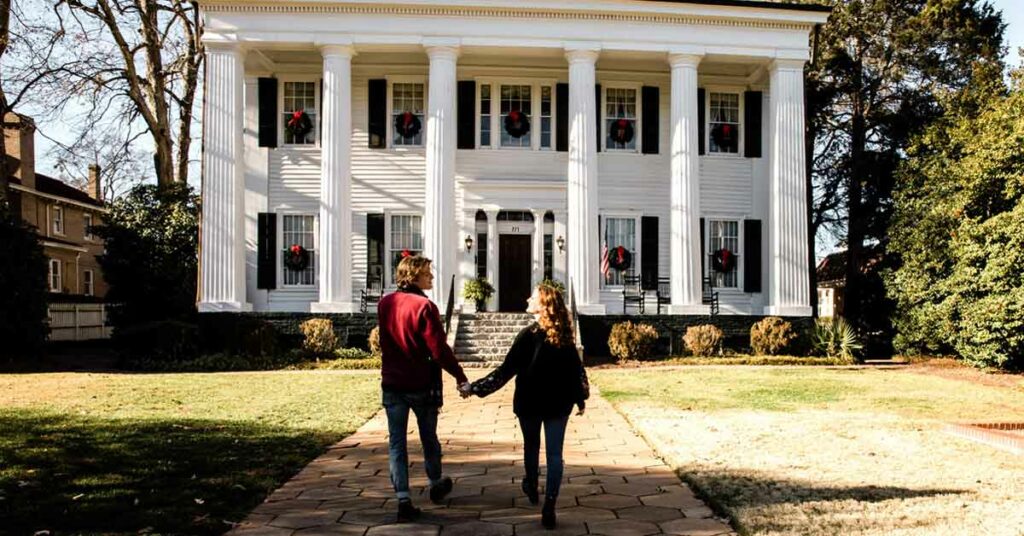 A young couple tours Heritage Hall during the holidays