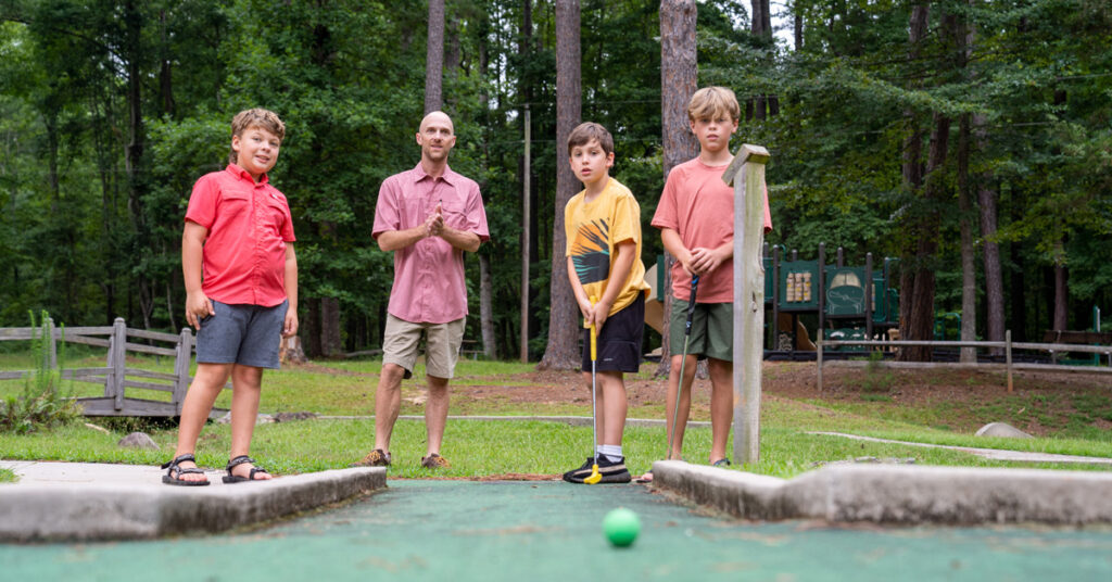 Family playing mini golf at Hard Labor Creek State Park