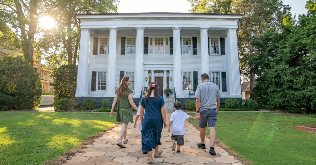 Family entering tour of Heritage Hall in Madison, GA