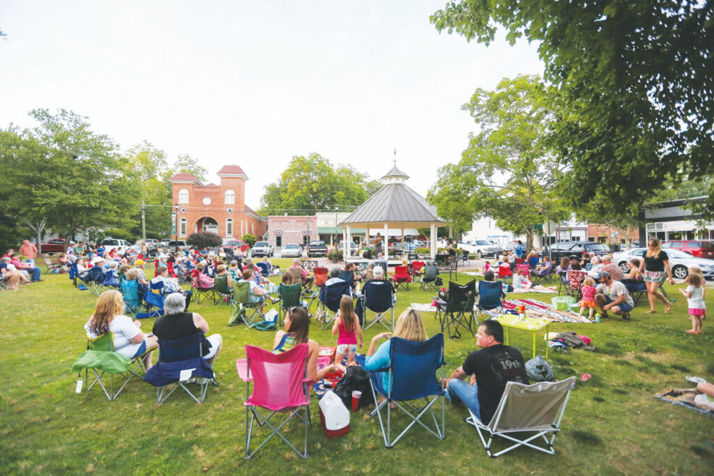 "Crowd listening to live music at the gazebo in Rutledge Town Park."