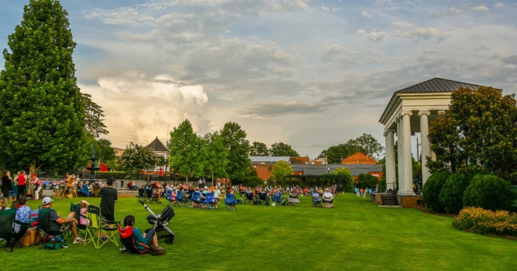 People on the lawn of Town Park listening to a Summer Nights concert.