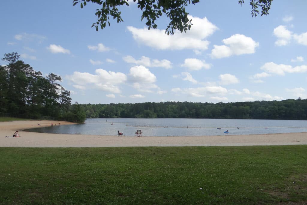 People beat the heat at the beach at Hard Labor Creek State Park.