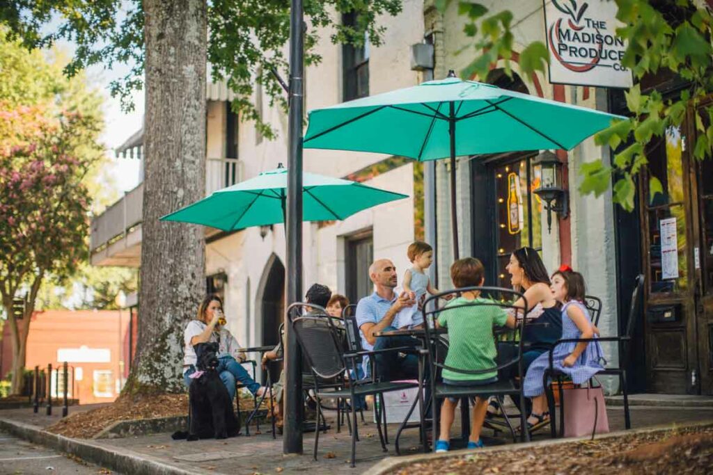 Dog with diners in Madison, GA in the fall season