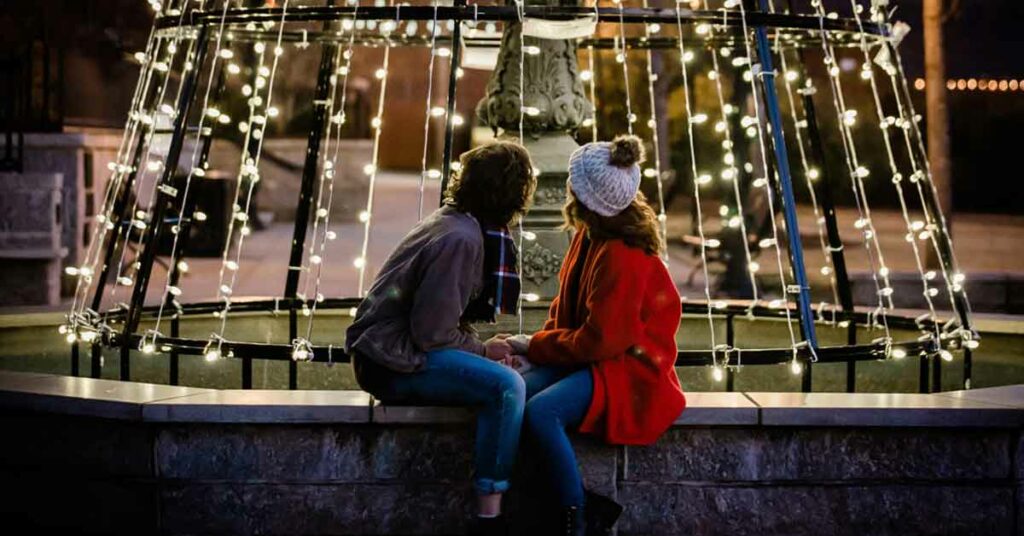 A young couple enjoys a small town Christmas in MerryMadisonGA