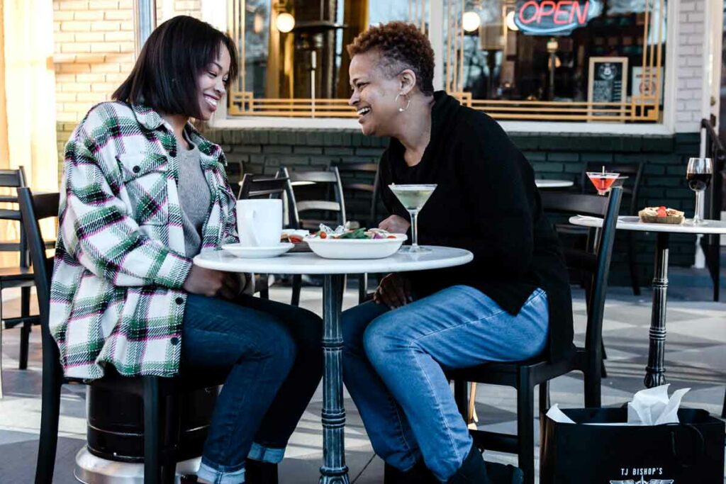 Women laughing while dining at The Sinclair.