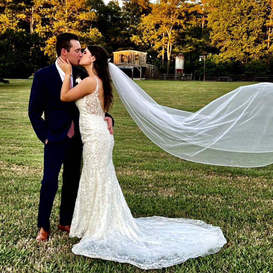 Bride and groom kiss.