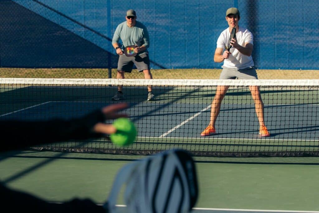 Player about to serve in pickleball.