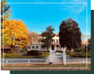 The historic Boxwood house in Madison, GA among fall foliage.