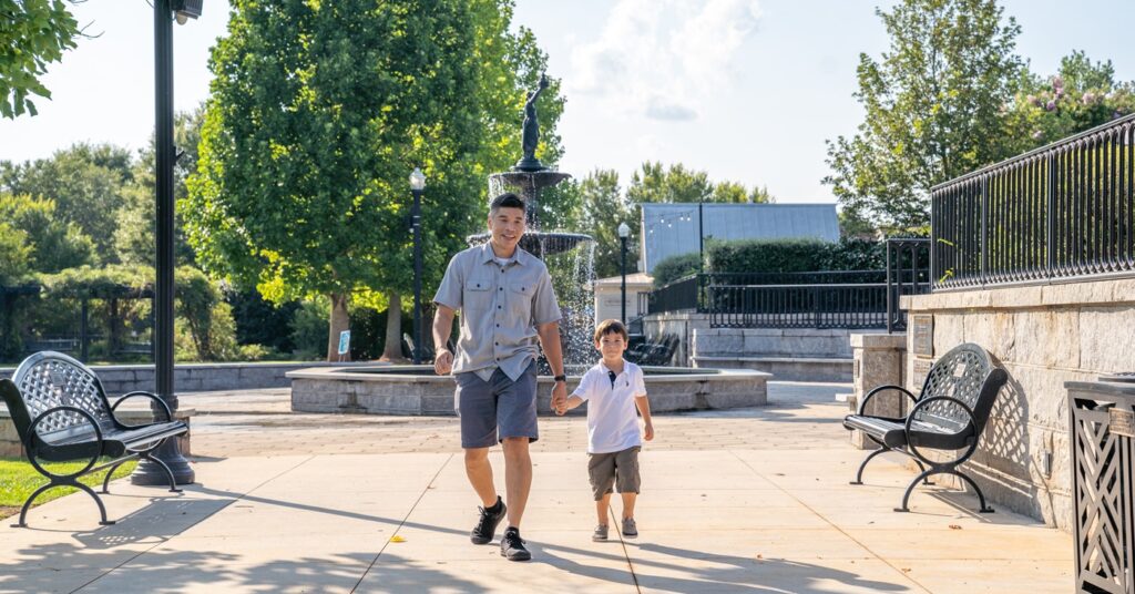 Father and Son at family friendly Madison Town Park on Family Vacation. One of the best things to do with kids and one of the best summer vacations for families.