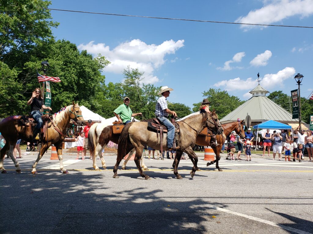 People riding horses at the Rutledge Country Fair. One of the Memorial Day Weekend events in Madison GA.