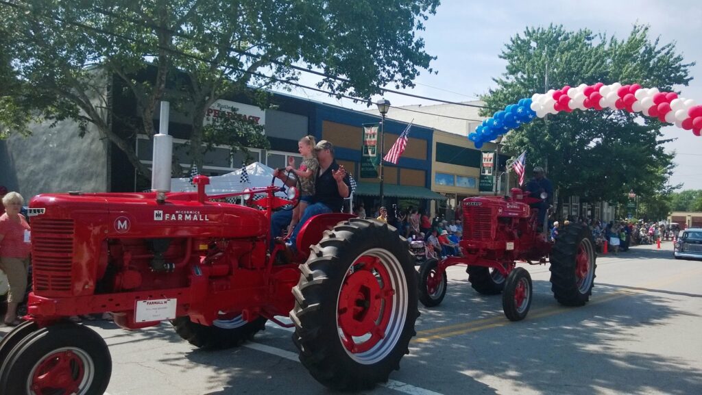 Tractors ride through parade at Rutledge Country Fair