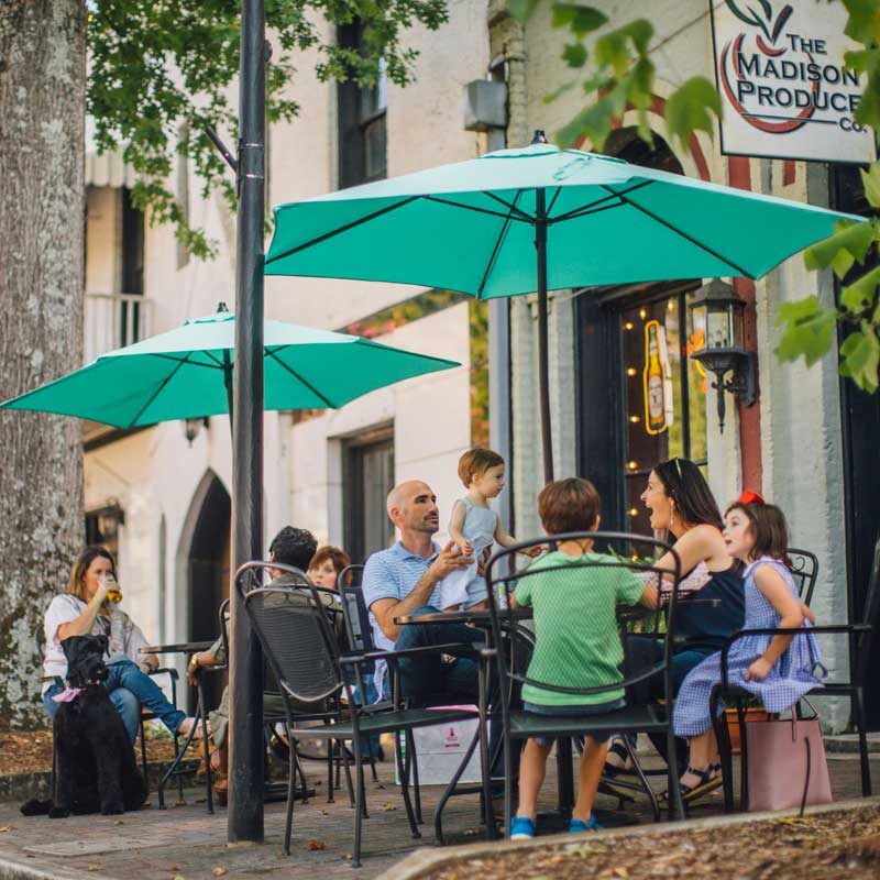 Family dines outdoors in downtown Madison, GA
